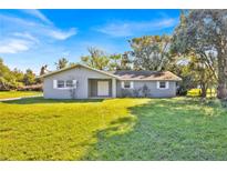 Charming one-story home with a well-maintained front yard and freshly painted exterior at 495 Orange Ave, St Cloud, FL 34769