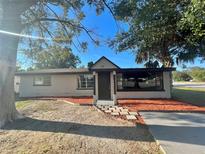 Charming single-story home featuring new landscaping, neutral paint, and a welcoming entrance at 201 4Th Jpv St, Winter Haven, FL 33880