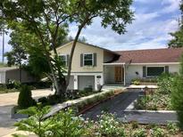 Charming home with landscaped yard, a beautiful front yard, and a driveway at 539 Libby Rd, Babson Park, FL 33827