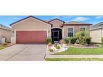Charming single-story home featuring a well-maintained lawn and an attached two-car garage at 3471 Julius Estates Blvd, Winter Haven, FL 33881