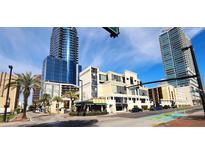 Metropolitan building street view showcasing modern architecture and convenient street access at 151 E Washington St # 327, Orlando, FL 32801