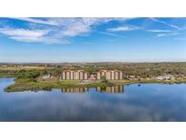 Beautiful lakefront condo complex with stunning views and lush landscaping at 16300 County Road 455 # 612, Montverde, FL 34756
