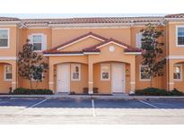 Charming multi-Gathering home with a colorful exterior, well-maintained landscaping, and convenient parking at 2652 Corvette Ln, Kissimmee, FL 34746