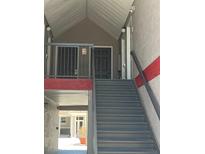 View of exterior stairs leading to a condo entrance at 3100 Parkway Blvd # 325, Kissimmee, FL 34747