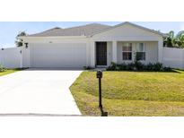 Charming single Gathering home featuring a two car garage and well maintained landscaping at 624 Mercado Ct, Kissimmee, FL 34758
