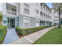 Charming apartment building featuring coastal colors, covered balconies, and meticulous landscaping at 783 Celebration Ave # 783, Celebration, FL 34747