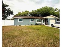 Charming single-story home featuring a well-maintained lawn, and a single car garage at 6337 Lido Ct, Orlando, FL 32807