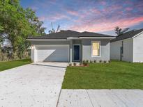 Charming single-Gathering home featuring a well-manicured lawn and an attached one-car garage at 1449 Monte Carlo Trl, Orlando, FL 32805