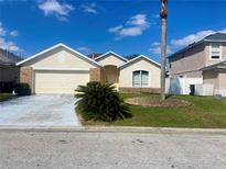 Charming one-story home featuring a well-maintained lawn and a two-car garage at 366 Jaybee Ave, Davenport, FL 33897