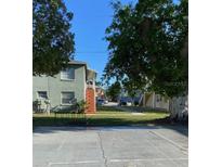 Two story home featuring large lawn in front at 723 Michigan Ct # 3, St Cloud, FL 34769