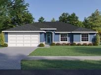 Charming single-Gathering home featuring a well-maintained lawn, a two-car garage, and a welcoming entrance at 101 Sail Way, Kissimmee, FL 34759