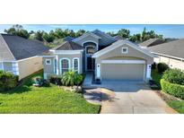 Charming single-story home with well-manicured lawn and inviting curb appeal at 121 Fitzgerald Ln, Davenport, FL 33837