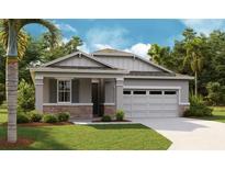 Charming single-Gathering home with a stone-accented facade, two-car garage, and well-manicured lawn at 4076 Bannock Ave, Tavares, FL 32778