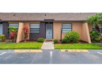 Charming condo with lush landscaping, well-maintained lawn and an inviting front entrance at 2305 St Marteen Ct # 2305, Kissimmee, FL 34741