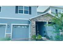 Charming two-story home with stone accents and a well-maintained front yard at 2789 Pleasant Cypress Cir, Kissimmee, FL 34741