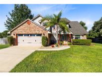 Charming two-story home with brick accents, well-manicured lawn, and inviting curb appeal in a desirable neighborhood at 3820 Forest Cir, St Cloud, FL 34772