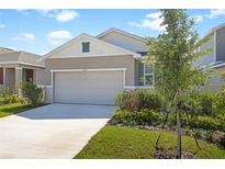 Charming single-story home with a two-car garage, well-manicured lawn, and tasteful landscaping at 6389 Clover St, Lake Hamilton, FL 33851
