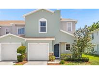 Charming two-story home with a well-maintained lawn and attached one-car garage at 2575 Aventurine St, Kissimmee, FL 34744