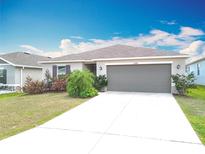 Charming single-story home featuring a two-car garage and well-maintained landscaping at 16588 Centipede St, Clermont, FL 34714