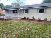 Charming single-story home featuring a fresh white exterior and a covered front porch at 3135 Old Dixie Hwy, Auburndale, FL 33823