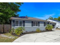 Charming home featuring a manicured front yard with lush landscaping, enhancing its curb appeal at 1316 N Bumby Ave, Orlando, FL 32803