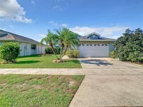 Charming single-Gathering home with well-manicured lawn and a two car garage at 832 Whalebone Bay Dr, Kissimmee, FL 34741