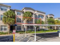 Beautiful condo with palm trees and covered parking at 3301 Whitestone Cir # 203, Kissimmee, FL 34741