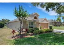 Charming single-Gathering home with well-maintained landscaping and inviting curb appeal at 265 Del Sol Ave, Davenport, FL 33837