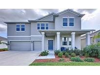 Beautiful two-story home with a two-car garage, covered porch, and well-maintained landscaping at 4190 Bull St, St Cloud, FL 34772