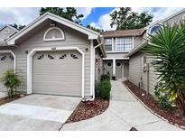 Charming townhome exterior with neutral siding, attached garage, and well-maintained landscaping at 554 Northbridge Dr, Altamonte Springs, FL 32714