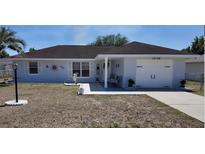 Charming single Gathering home featuring a one-car garage and well maintained lawn and landscaping at 15106 Sw 38Th Cir, Ocala, FL 34473