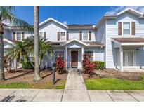 Charming townhome with a landscaped front yard and covered entrance at 2903 Edenshire Way # 103, Kissimmee, FL 34746
