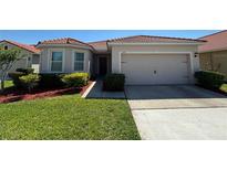 Well maintained single Gathering home with tile roof and manicured landscaping at 3105 Sangria St, Kissimmee, FL 34744