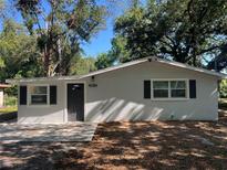 Charming single story home featuring a freshly painted exterior, dark shutters, and a well-manicured front yard at 3815 Nw Avenue R Ave, Winter Haven, FL 33881