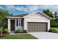 Charming single-story home featuring a two-car garage, covered entry, and well-maintained landscaping at 804 Lake Dell Rd, Dundee, FL 33838