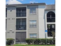 Three story condo building with screened in patios and handicap parking at 2130 Cascades Blvd # 108, Kissimmee, FL 34741