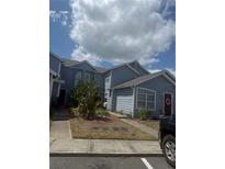 Charming two-story home with a well-manicured lawn and inviting curb appeal at 567 Caribbean Dr, Davenport, FL 33897