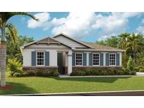 Charming single-story home with stone accents, blue shutters, and lush green lawn at 1003 Cloud Ridge Ct, Mount Dora, FL 32757