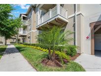 Attractive exterior with well-maintained landscaping, balconies, and architectural details at 1231 Wright Cir # 108, Kissimmee, FL 34747