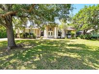 Charming one-story home with well-manicured lawn and mature trees providing ample shade at 2374 Eagle Trace Dr, Kissimmee, FL 34746