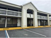 Exterior view of a building featuring a large number 1 and a balcony at 5245 W Irlo Bronson Memorial Hwy # 210, Kissimmee, FL 34746
