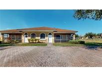 Charming single story villa with brick paved driveway and well-maintained landscaping at 1558 Cumin Dr, Poinciana, FL 34759