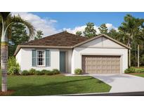 Charming single-story home with a well-manicured lawn and attached two-car garage at 1030 Wisteria Way, Dundee, FL 33838