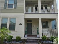 Charming two-story home featuring a covered entry, neat landscaping, and a cozy front porch at 15929 Moonlight Bay St, Winter Garden, FL 34787