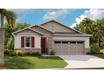 Charming single-story home featuring stone accents, red shutters, and a two-car garage at 175 Flag Lilly Ln, Umatilla, FL 32784
