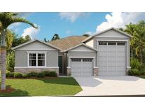 Charming single-Gathering home featuring a three-car garage, stone accents, and well-manicured landscaping at 333 Alexandrite St, Deland, FL 32720