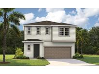 Two-story home with a neutral color scheme, front-facing garage, and well-maintained landscaping at 741 Lake Dell Ave, Dundee, FL 33838