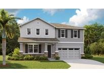 Charming two-story home with stone accents, a well-manicured lawn, and a welcoming covered front porch at 1066 Cloud Ridge Ct, Mount Dora, FL 32757