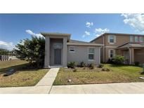 Charming single-Gathering home with manicured lawn and inviting entrance at 5624 Beggs Rd, St Cloud, FL 34771