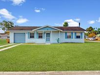 Charming single-story home with well-maintained lawn and blue shutters at 98 Pinata Ct, Kissimmee, FL 34743